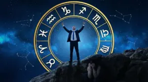 Due persone davanti a un cerchio zodiacale, una esulta e l'altra si copre il viso